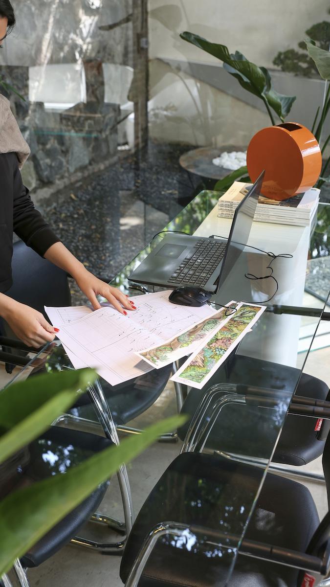 image of a cafe with plants behind it